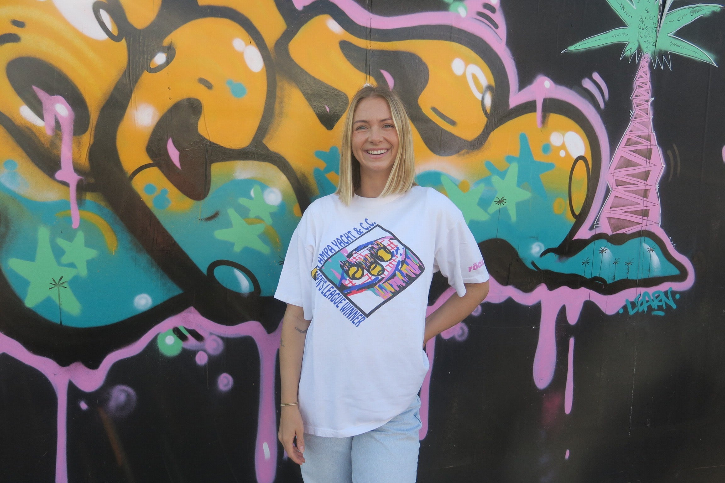 Vintage tennis shirts and clothing worn by blonde woman in california