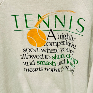 Tennis shirt graphic close up by Ace the Moon tennis brand that says "tennis a highly competitive sport where you're allowed to slam, chop and smash and love means nothing at all"