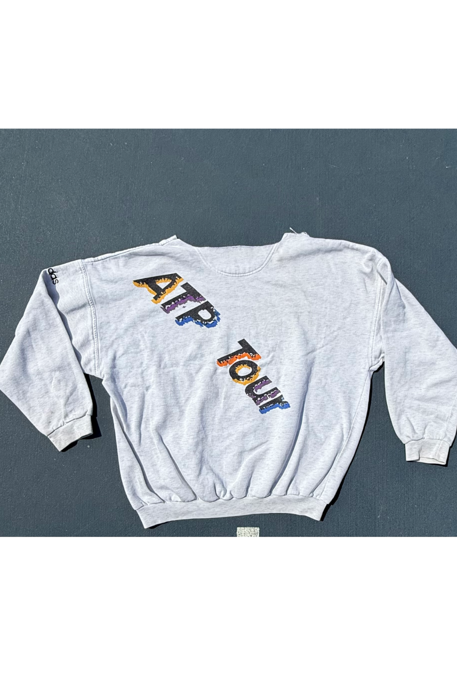 classic vintage womens tennis crewneck sweatshirt in heather gray showcasing 80's style font artwork of colorful text that says ATP Tour by Ace the Moon Tennis Brand