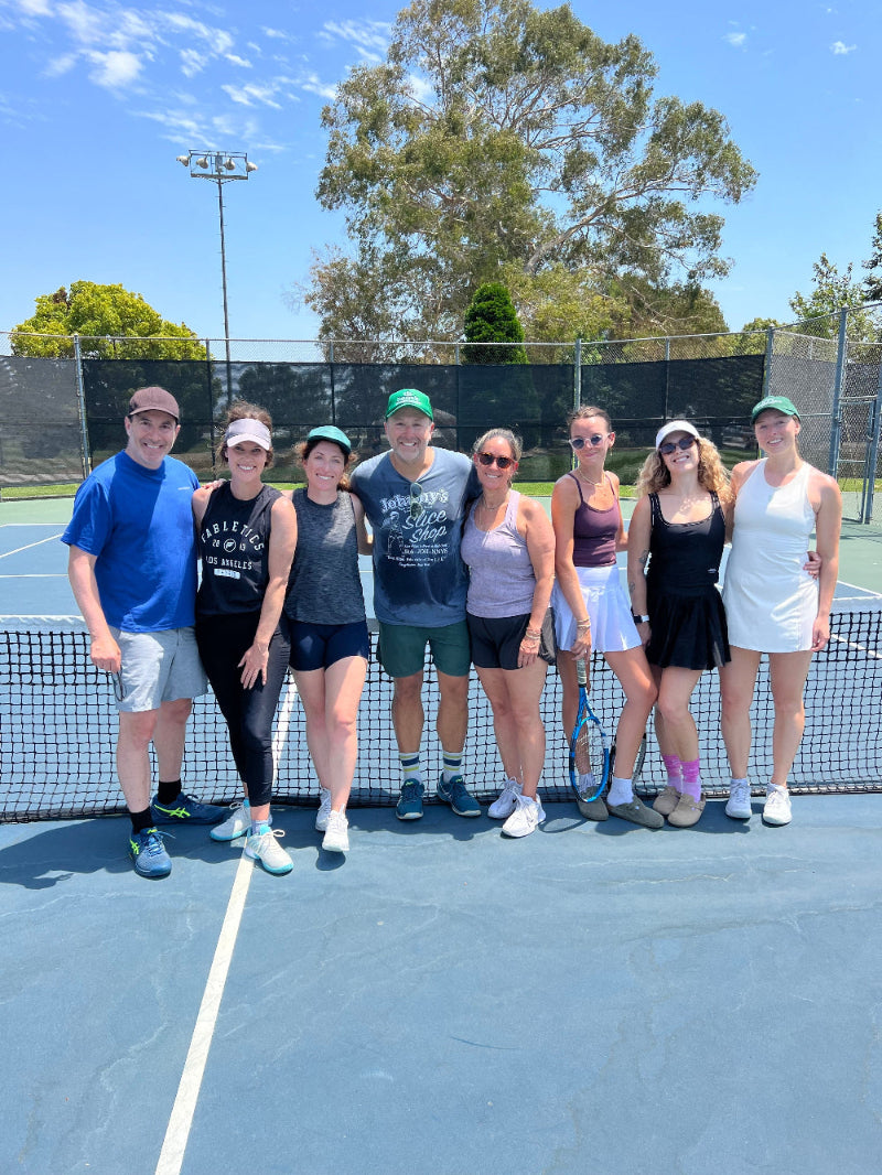 tennis friends hanging on the court