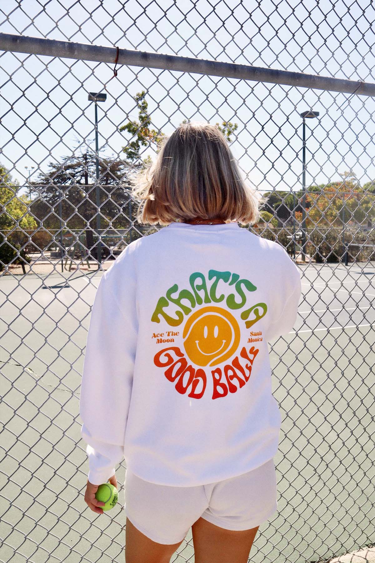 That's a good ball crewneck sweatshirt by Ace the Moon tennis and pickleball apparel brand