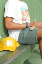 Tennis shorts in green with Tennis trucker hat in yellow by Ace the Moon Tennis Brand Los Angeles