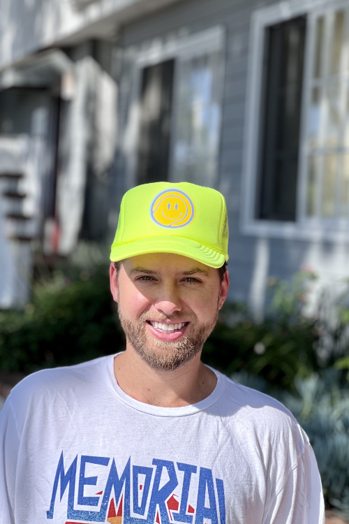 Tennis ball trucker hat and memorial park vintage tee sold by Ace the Moon Tennis and pickleball apparel brand los angeles