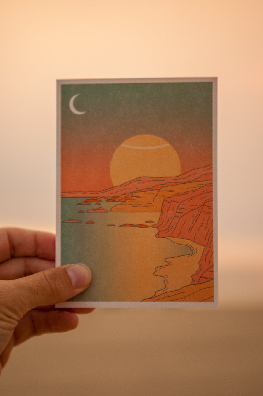 beautiful stationary by Cai & jo of a sunset coastline showcasing a sun as a tennis ball. sold by Ace the Moon tennis brand