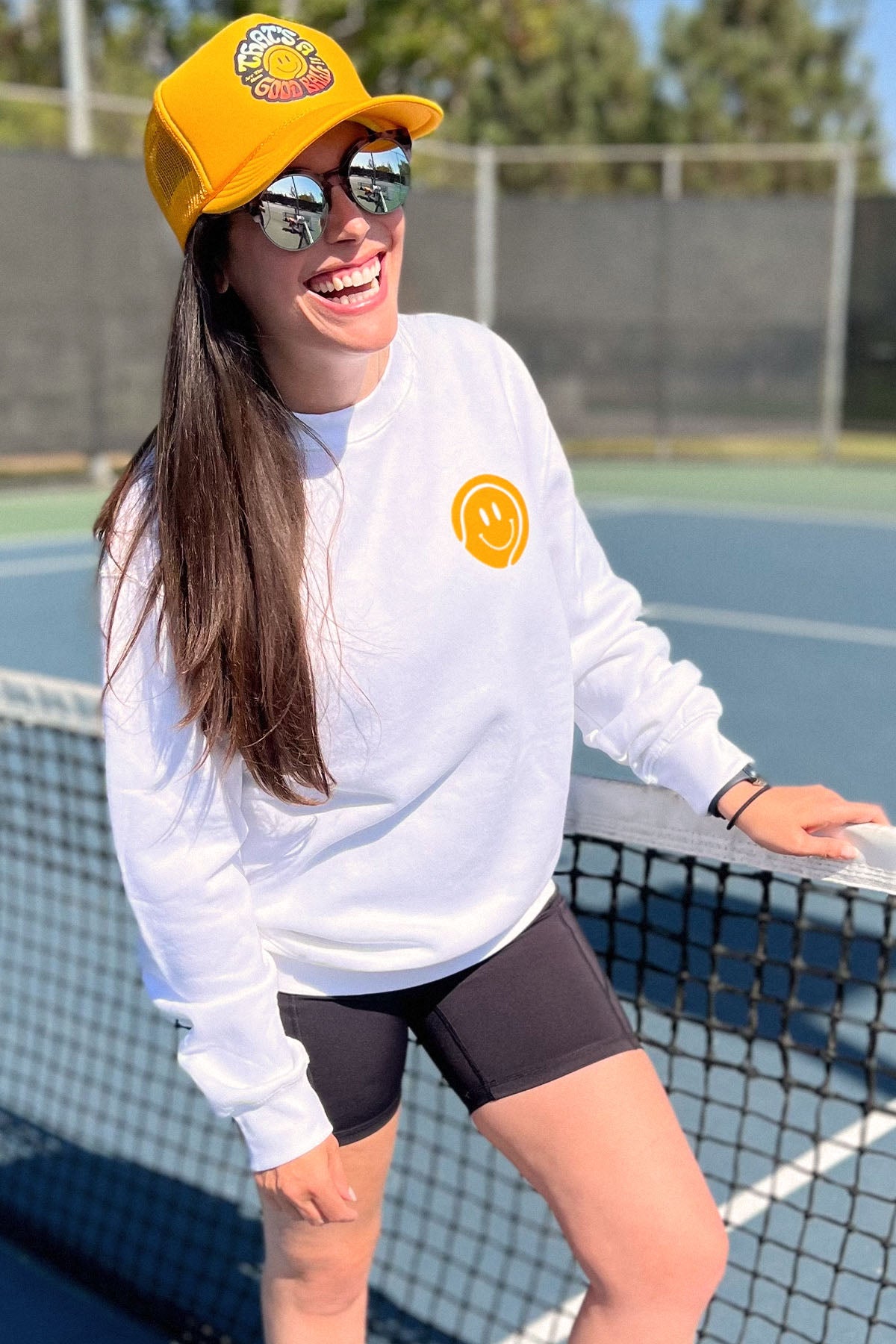 thats a good ball tennis trucker hat and crewneck sweatshirt by Ace the Moon tennis apparel brand LA
