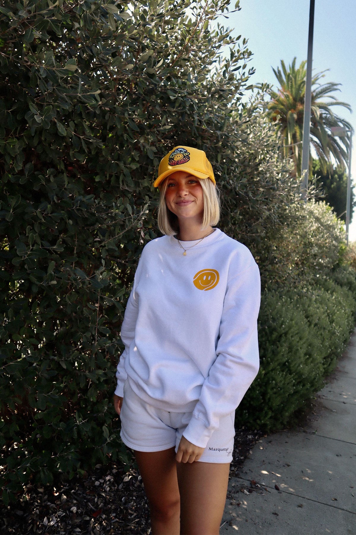 thats a good ball tennis trucker hat and crewneck sweatshirt by Ace the Moon tennis apparel brand LA