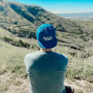 stoked 4 strokes tennis hat by Ace the moon tennis and pickleball apparel brand los angeles california. blue nylon hat